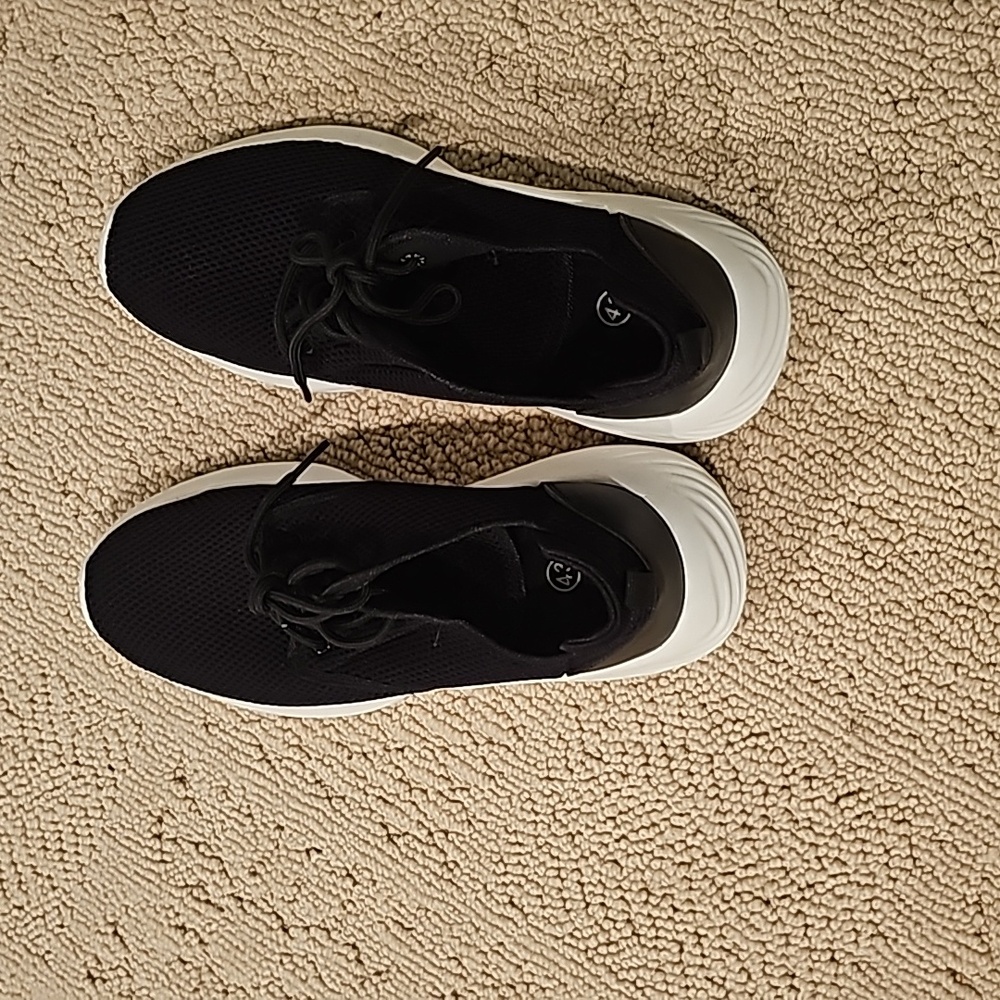 Blavmck and white trainers